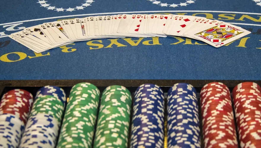 Blackjack table with cards and chip stacks