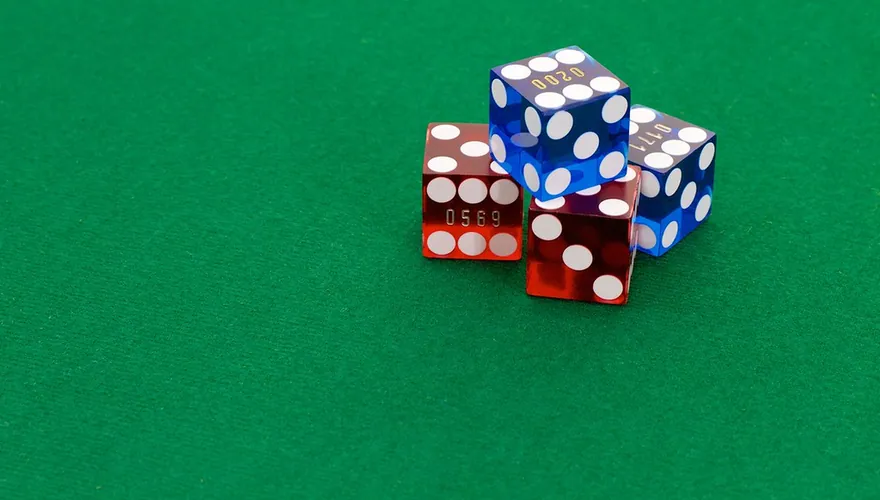 Casino dice on green felt