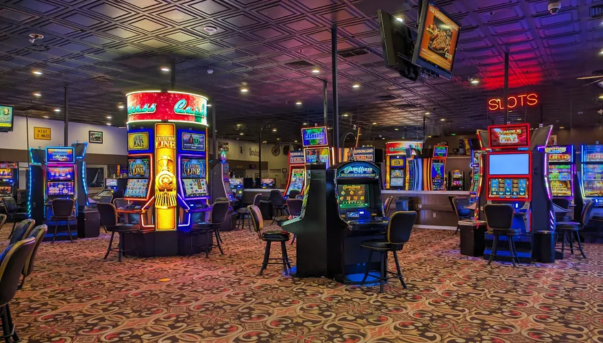 Casino floor lined with slot machines