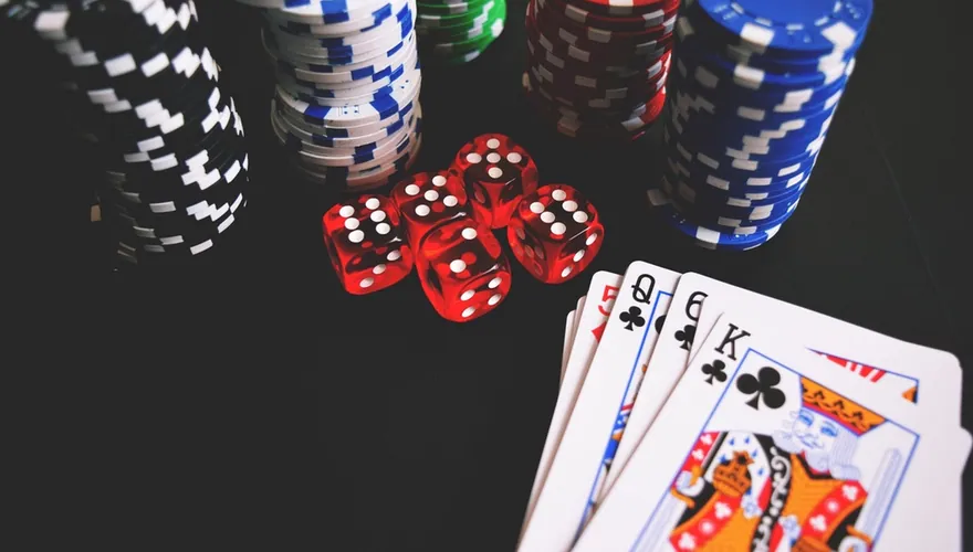 Casino chips, dice and cards on a table